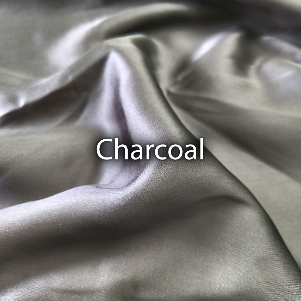 Hallo 4PCS FITTED SHEET SET 3 Close up shot of a loosely laid Hallo bedsheet in charcoal