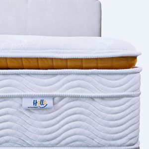 Front view of a Hallo Premium Gold mattress with a Hallo logo tag in view